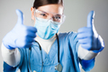 Caucasian female doctor showing two thumbs up - PhotoDune Item for Sale