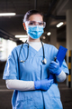 Portrait of young pretty female doctor wearing blue uniform - PhotoDune Item for Sale