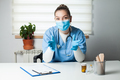 Portrait of female doctor wearing protective gloves and face mask - PhotoDune Item for Sale