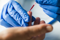 Medical technician EMS doctor taking finger prick PRP patient blood sample using pipette - PhotoDune Item for Sale