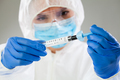 Medical technologist inspecting quick antigen test kit - PhotoDune Item for Sale