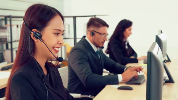 Business People Wearing Headset Working in Office