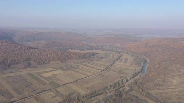 Aerial of Serbian landscape with fields and nature by autumn 4K drone footage