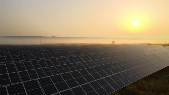 Aerial View of Big Sustainable Electric Power Plant with Many Rows of Solar Photovoltaic Panels for