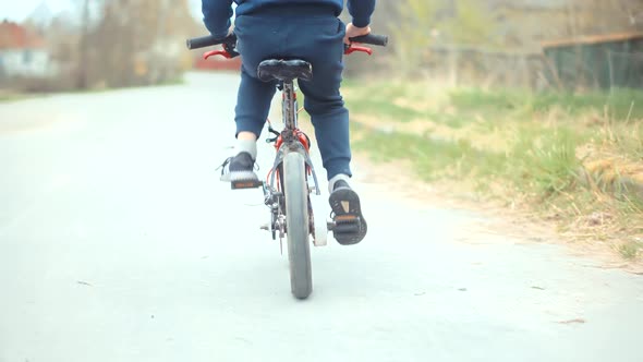 Active Child Riding Bike. Little Boy Cycling On Bicycle. Leisure Lifestyle Biking Recreation Ride.