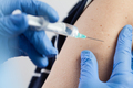 Medical worker injecting vaccine shot to patients shoulder, arm closeup detail - PhotoDune Item for Sale