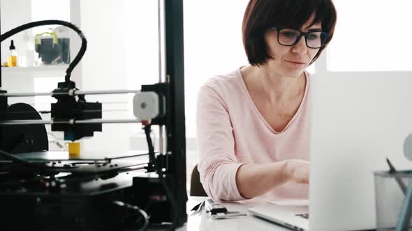 Adult Woman with 3D Printer