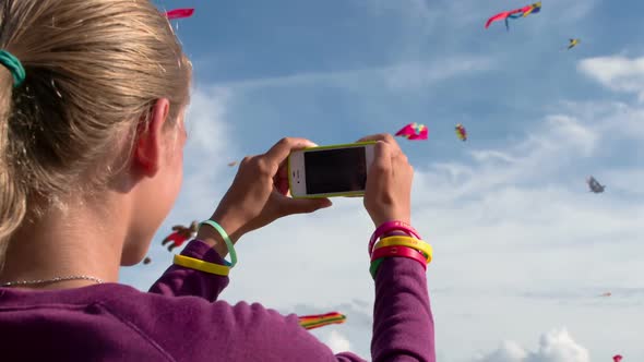 Girl Photographing Air Kites