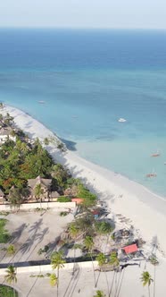 Vertical Video Boats in the Ocean Near the Coast of Zanzibar Tanzania