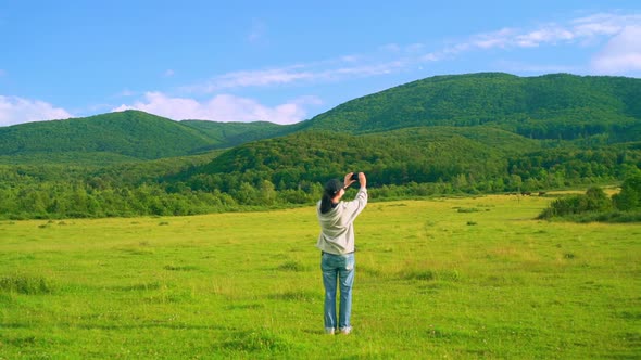 Hiker Photographs the Landscape