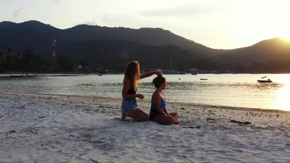 Girls best friends on luxury island beach break by blue water with white sand background of Koh Phan