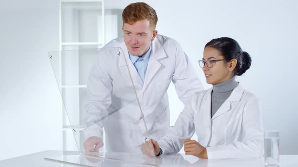 Two Doctors Using Transparent Multi-Touch Screen