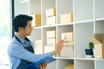 ness.Businessman checking inventory in stock room. Store house inspection