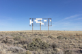 An old billboard, empty panels, in the middle of desert scrub. - PhotoDune Item for Sale
