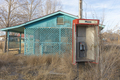Abandoned old phone booth and deserted store by the roadside. - PhotoDune Item for Sale