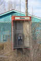 Abandoned old phone booth and deserted store by the roadside. - PhotoDune Item for Sale