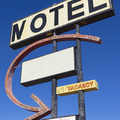 Old rusting Motel sign by the roadside. - PhotoDune Item for Sale