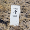 Caution watch for snakes sign in the desert. - PhotoDune Item for Sale