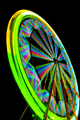 Fairground ferrish wheel with lights in rainbow colours, against a black sky. - PhotoDune Item for Sale