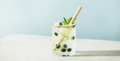 Trendy summer drinks with cucumber, mint and blueberry on blue sky background - PhotoDune Item for Sale