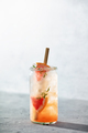 Trendy summer drink with grapefruit and rosemary close up. Sunny day shadows - PhotoDune Item for Sale