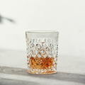 Glass of whiskey with ice cubes close up - PhotoDune Item for Sale