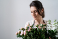 WOMAN EMBRACING a bunch of flowers on white background - PhotoDune Item for Sale