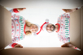 Surprised couple unpack Christmas gift box - PhotoDune Item for Sale