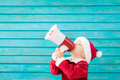 Happy child wearing Santa Claus costume speaking by megaphone - PhotoDune Item for Sale