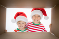 Surprised children unpack Christmas gift box - PhotoDune Item for Sale