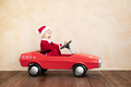 Happy child wearing Santa Claus costume playing at home - PhotoDune Item for Sale