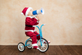 Happy child dressed Santa Claus costume playing at home - PhotoDune Item for Sale