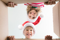 Surprised children unpack Christmas gift box - PhotoDune Item for Sale
