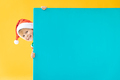 Happy child holding blue Christmas banner blank against yellow background - PhotoDune Item for Sale