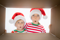 Surprised children unpack Christmas gift box - PhotoDune Item for Sale