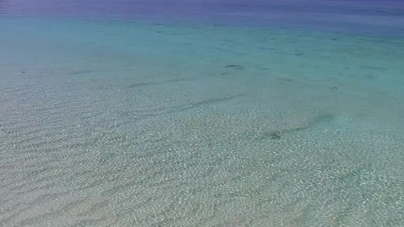 Sunny tourism of coast beach by blue lagoon with sand background near sandbank