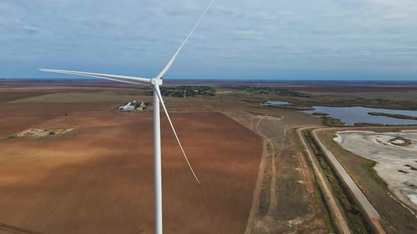 Aerial View of Powerful Wind Turbine Farm for Energy Production on Beautiful Seaside Landscape