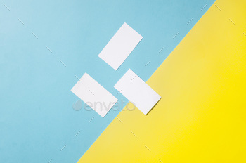  mockup template with shadows on blue and yellow paper background. Place your design.