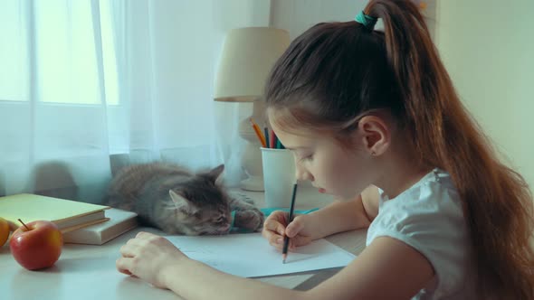 Little Girl Plays with her Pet Cat with Ribbon and Eats Apple