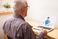Young female UK e-doctor consulting elderly man, online video help line virtual medical appointment - PhotoDune Item for Sale