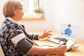 Elderly senior woman using sphygmomanometer blood pressure monitor to measure heart rate pulse - PhotoDune Item for Sale