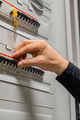 Close-up of Electric Technician Consultant Checking Fuse In Server Room - PhotoDune Item for Sale