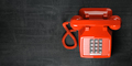 Red telephone on dirty background. Top view of vintage retro push button telephone - PhotoDune Item for Sale