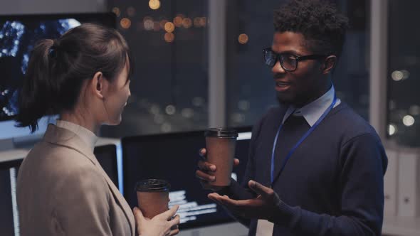 Two Colleagues Talking and Drinking Coffee