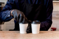 Barista making cappuccino.  Bartender preparing coffee drink for takeaway. - PhotoDune Item for Sale