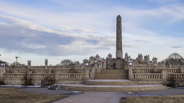 Tourists Visit Monolith Stone Pillar Surrounded With Granite Sculptures At Vigeland Facility In Frog