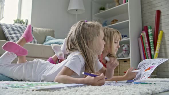 Cute Girls Chatting and Coloring