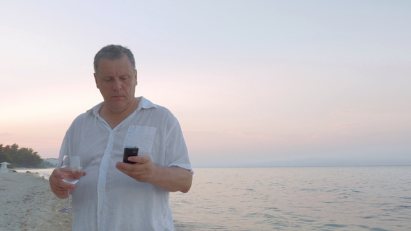 Man with Smartphone on Holiday