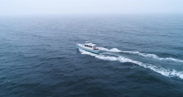 Aerial view of a wake of a speeding boat with its wake