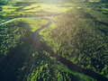 Aerial view road and curved river flowing through the green forest - PhotoDune Item for Sale